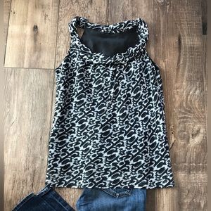 Beautiful Black, Gray and White Sleeveless Blouse. In excellent used condition.